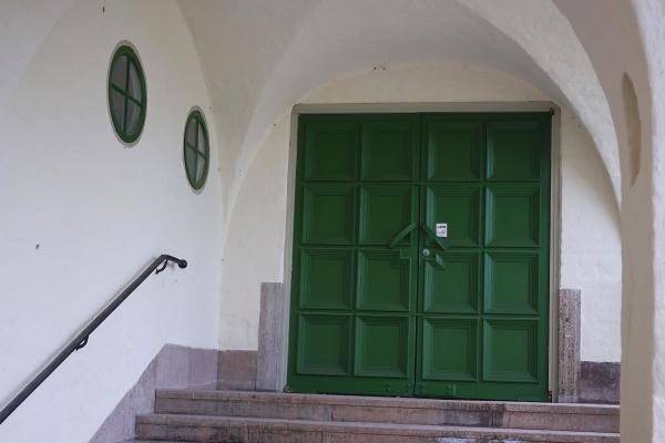 Entrance with green doors
